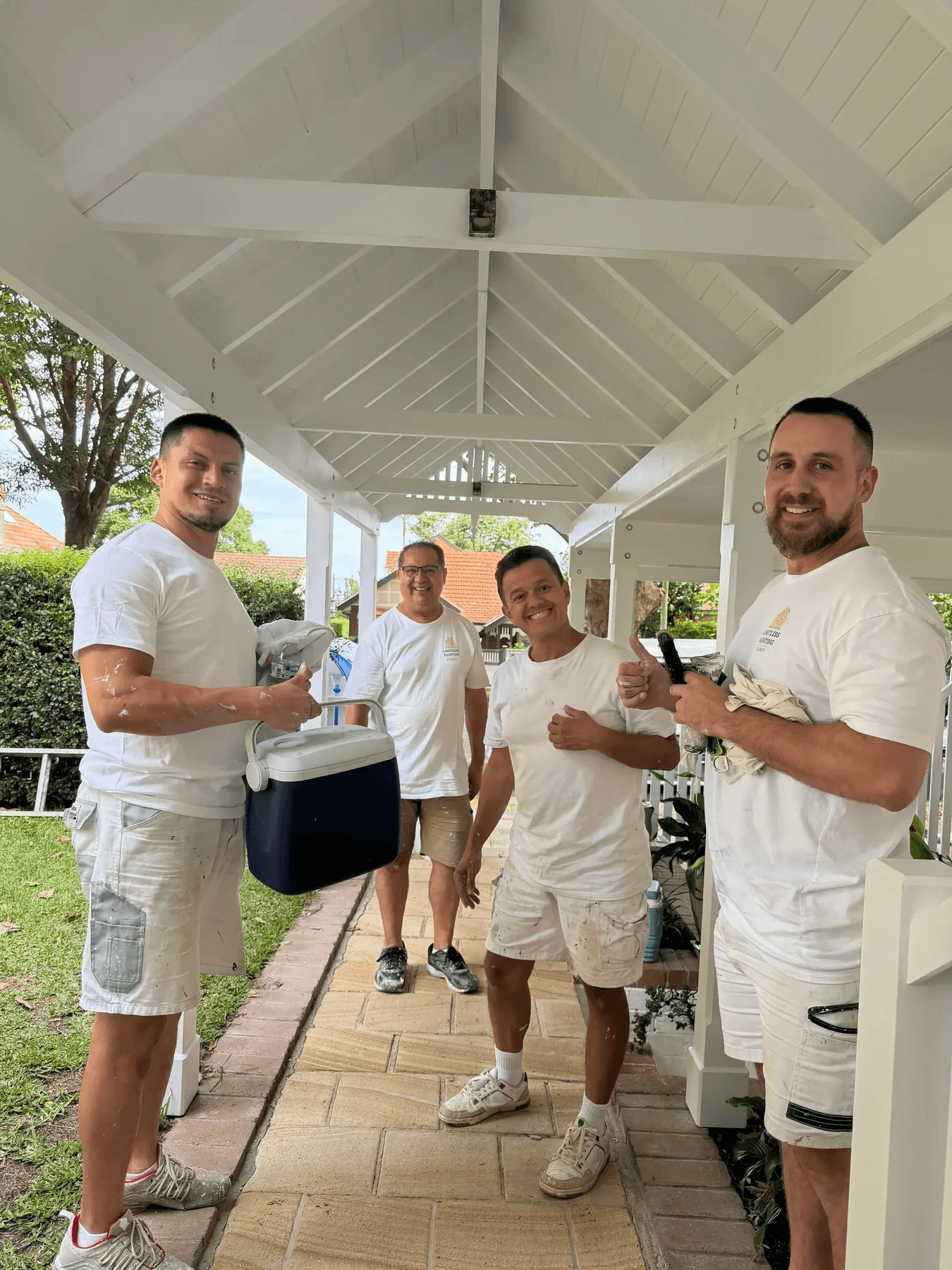 The Limitless Painting & Decorating crew on site in their painting whites
