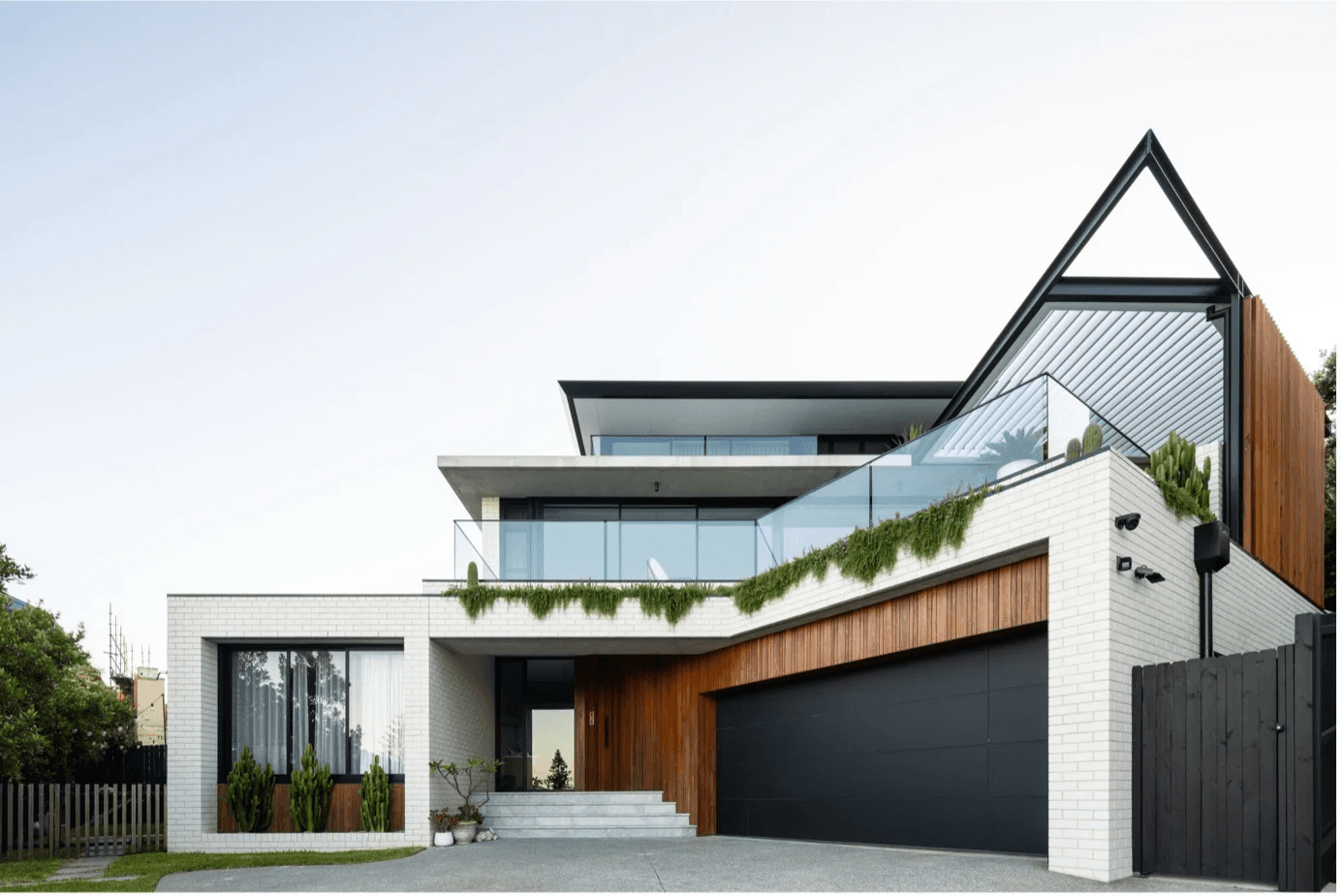 Modern rendered home exterior repainted to withstand coastal sun and salt